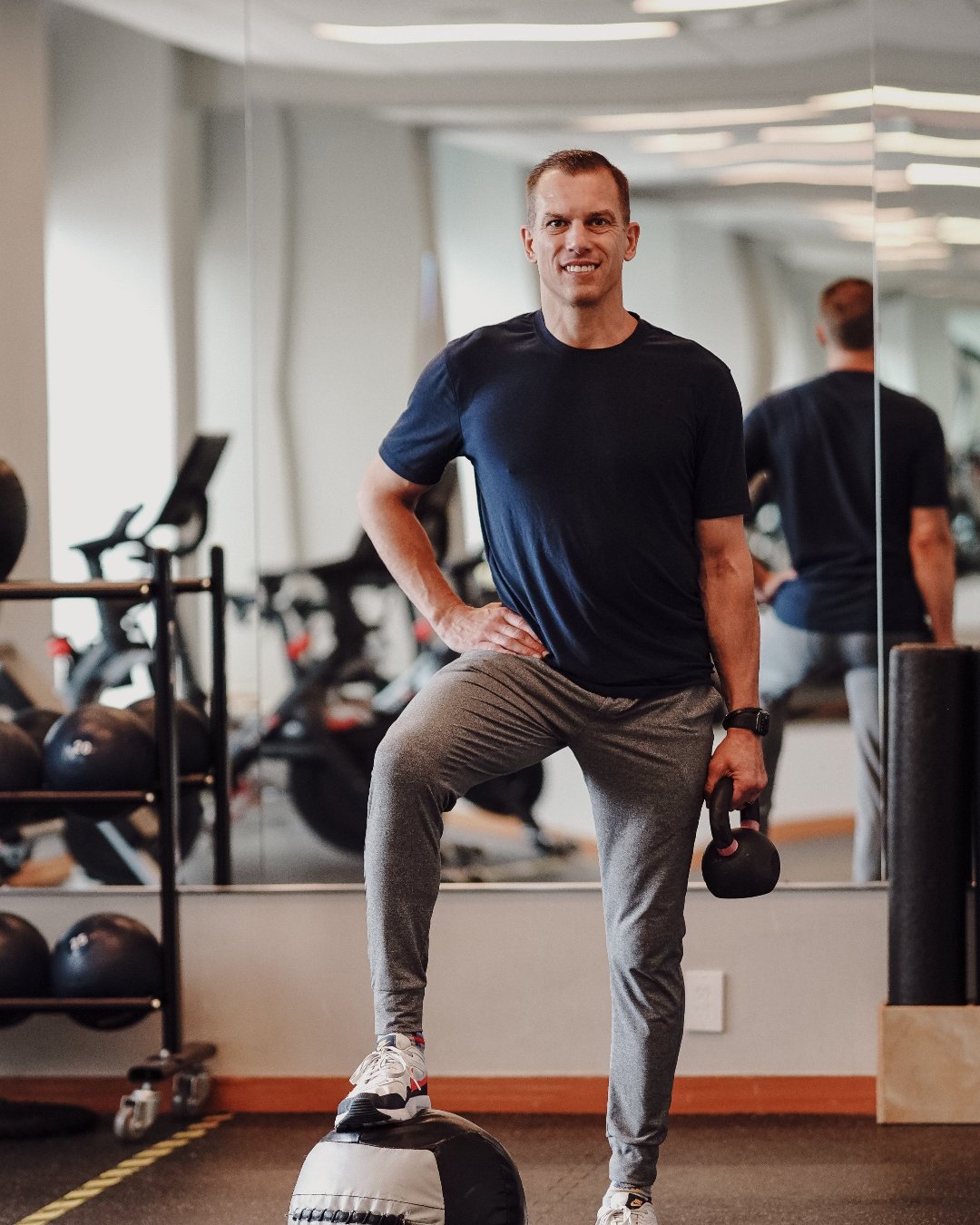 Jay Cardiello holding a kettleball